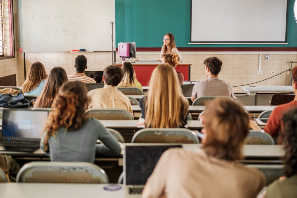 University classroom with diverse students and female lecturer in Malta